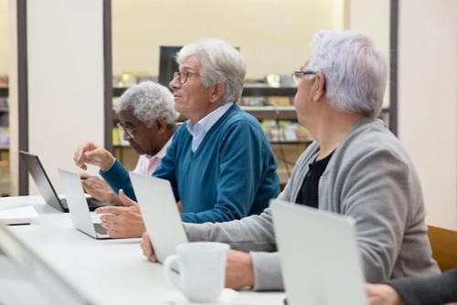 elderly people on computers